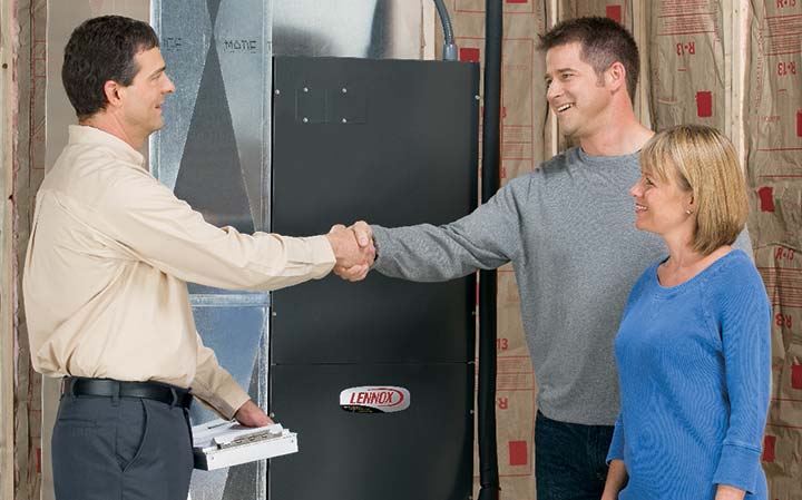 sales person shaking hands with clients