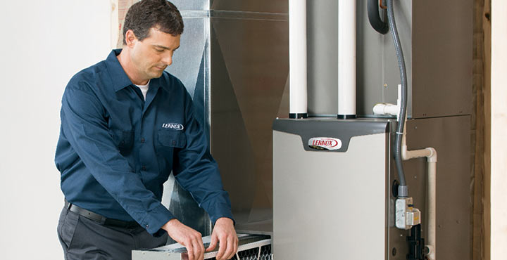 technician repairing air handler